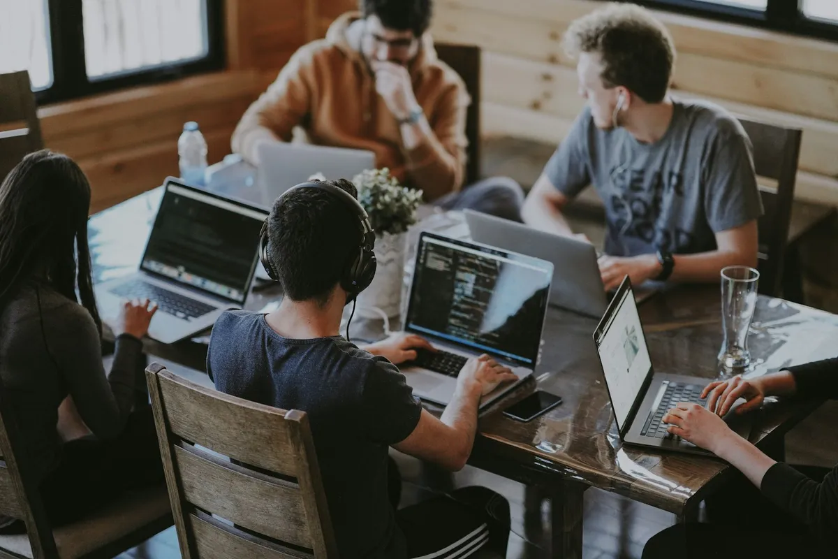 Small business team working on laptops